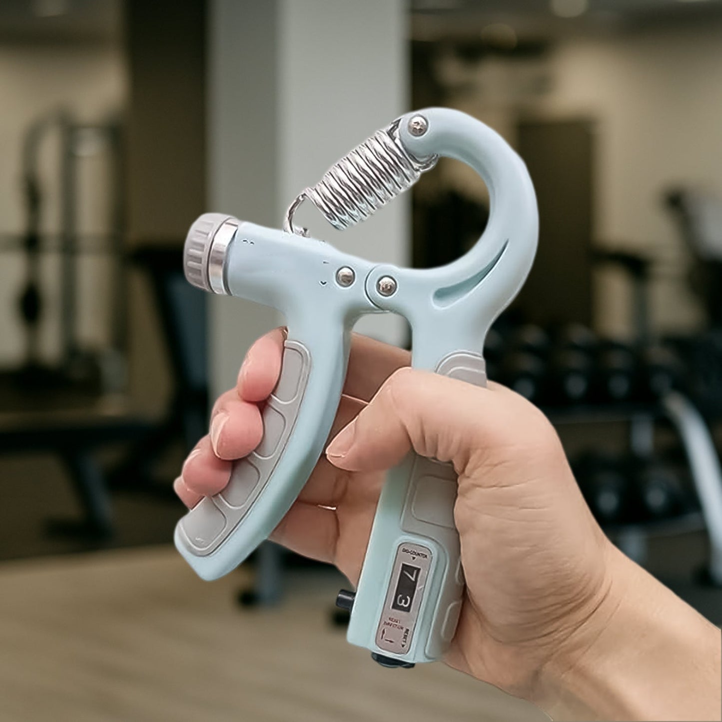 Compact grip strength trainer shown in travel-friendly pocket size