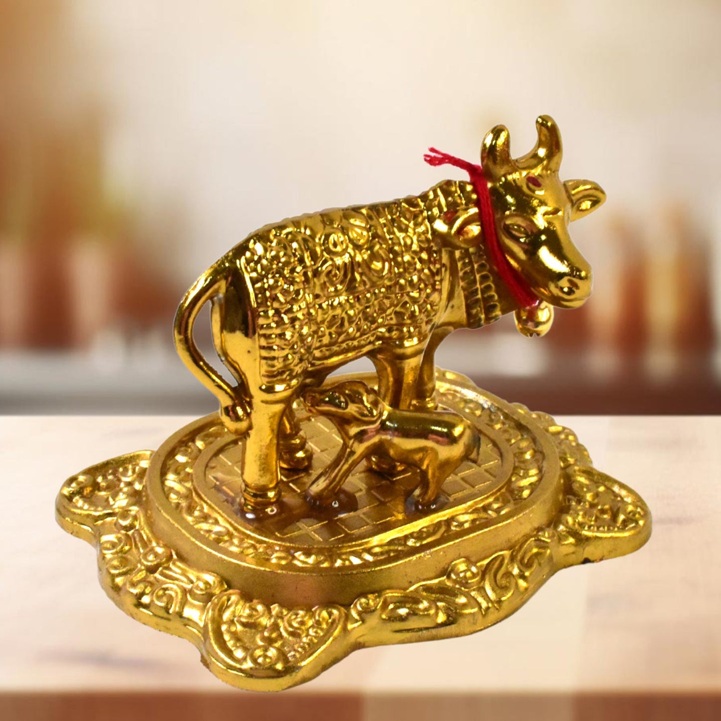 traditional metal Kamadhenu idol for Indian households, symbolic Kamdhenu cow idol for festivals and pooja ceremonies, handcrafted metal Kamdhenu cow and calf for home energy balancing