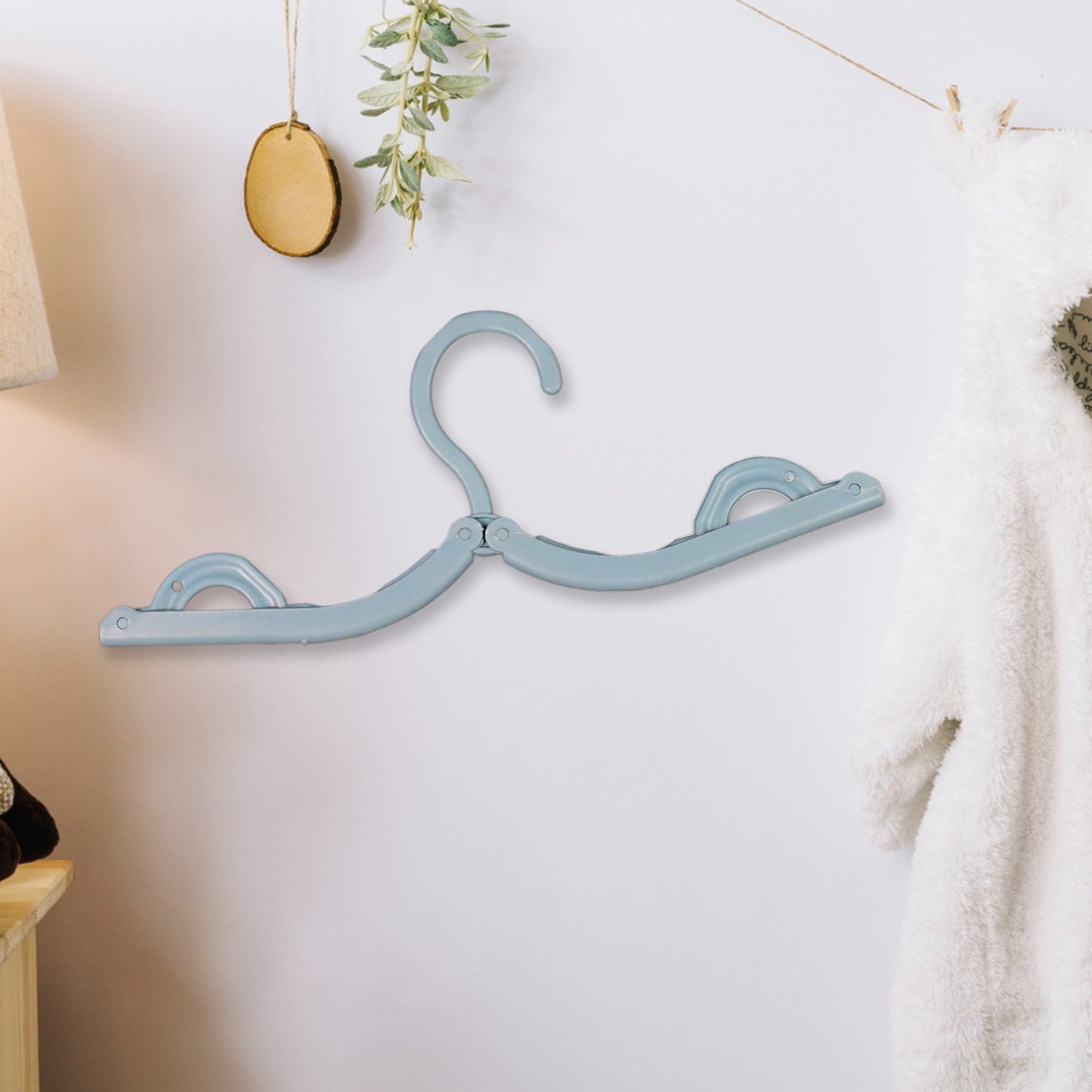 lightweight plastic hangers for easy packing, foldable hangers for drying clothes while traveling, multipurpose compact hangers with space saving design
