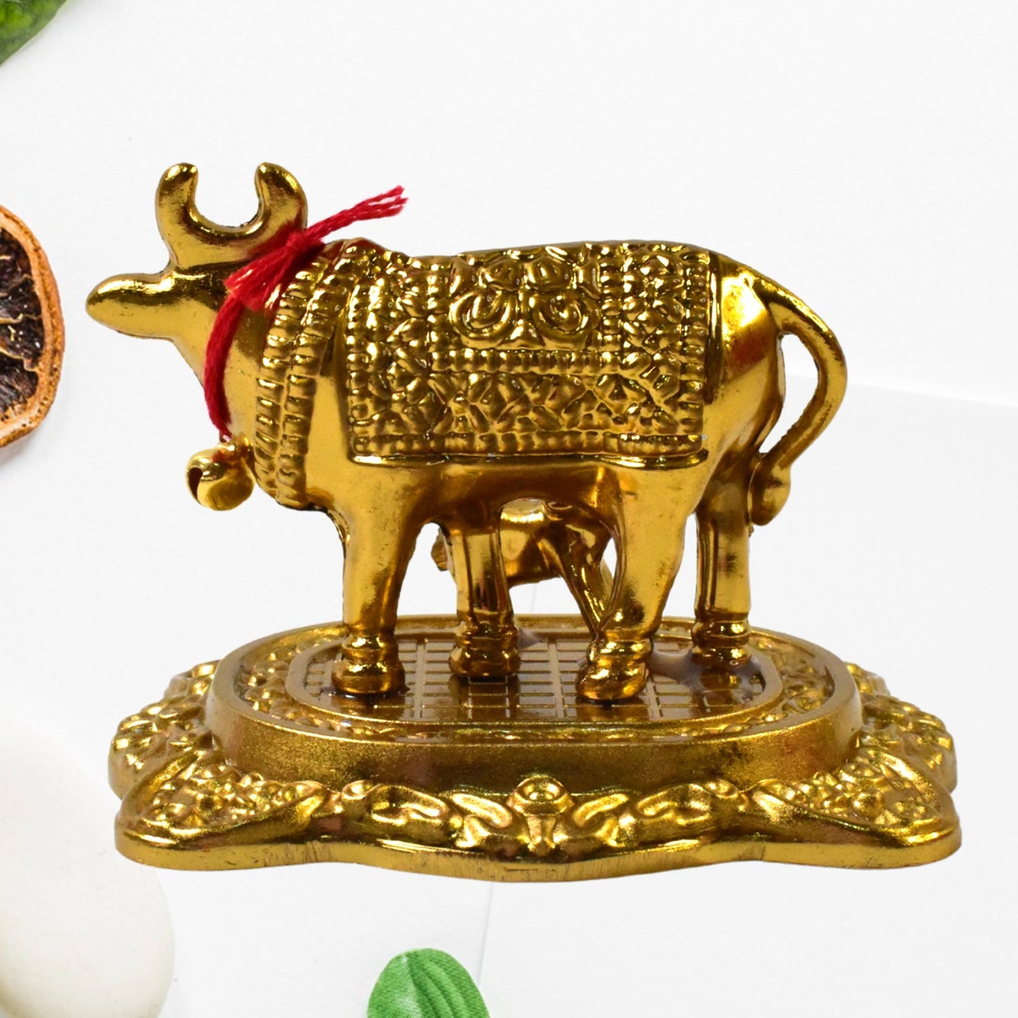 best golden Kamdhenu cow with calf idol for home decor in India, handcrafted metal Kamadhenu cow statue for pooja and vastu, spiritual cow and calf idol for divine blessings and peace, decorative Kamdhenu statue for temple and house decoration,
