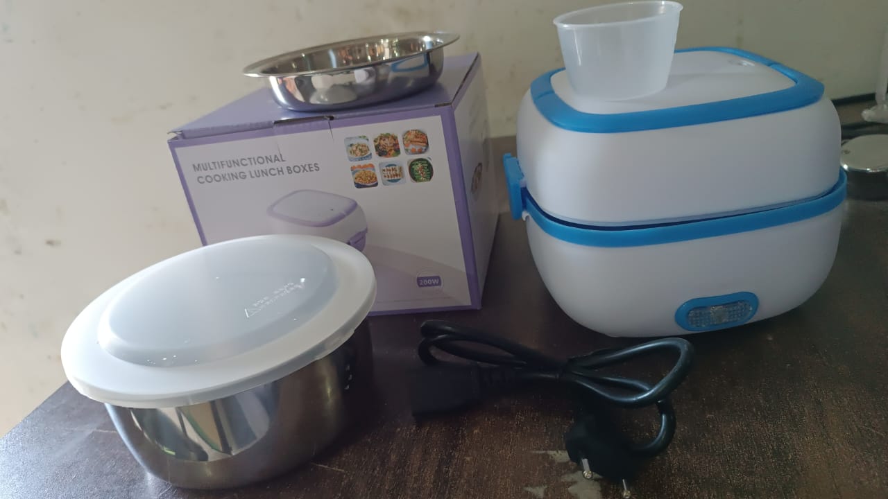 multifunctional electric tiffin for home and travel, electric lunch box for hot food on the go, stainless steel lunch box with heating element, electric lunch box for Indian meals, smart lunch box with steam cooking, plug-in lunch box with steel containers, daily use electric tiffin box for office goers, lunch box with food warming system India, portable lunch heater with steaming tray, electric lunch box combo with steamer