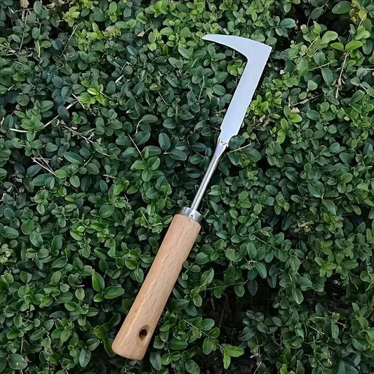 Gardening tool with a wooden handle and metal blade on a green leafy background, Manual weeders stainless steel tool showing arc blade shape and ergonomic wooden handle for garden weeding