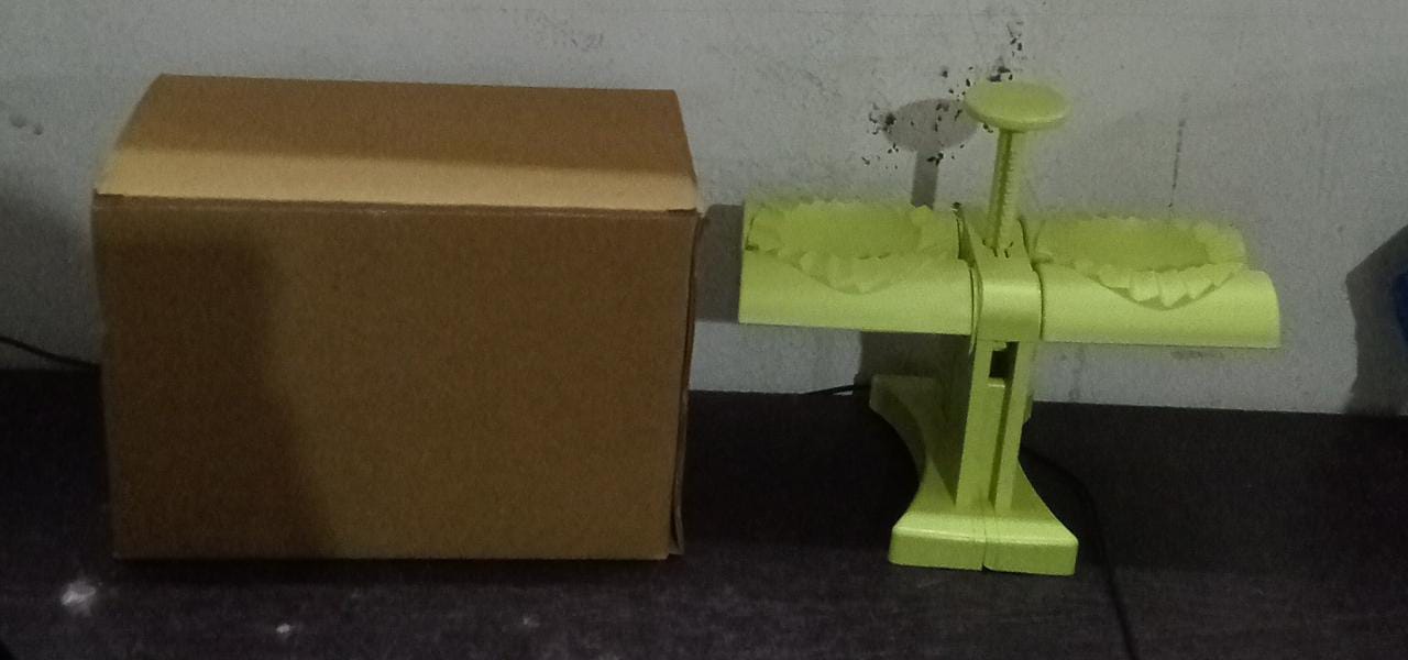 Dumpling press mold in brown box packaging, dumpling maker mold, double head dumpling press, momo maker tool, kitchen dumpling mold, gujiya press, easy dumpling maker, dumpling kitchen accessory