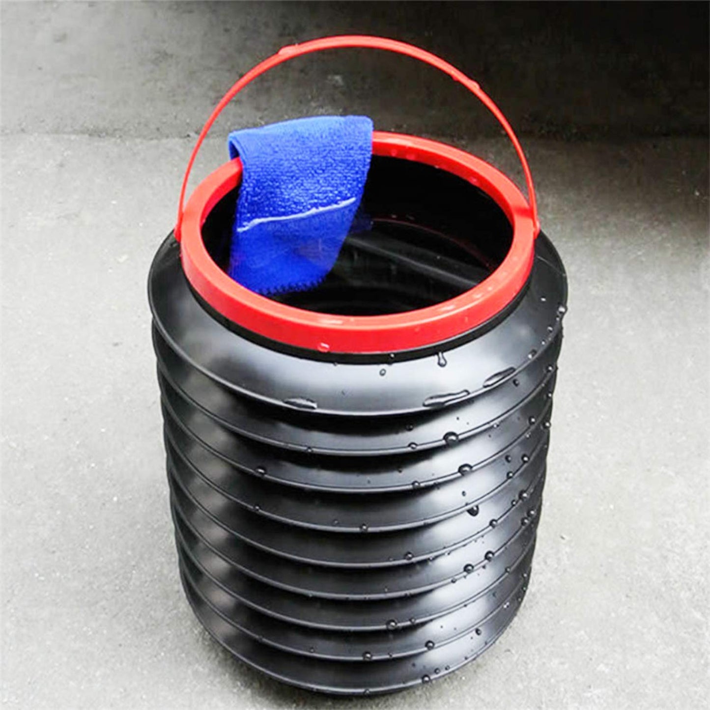 Top view of foldable bucket demonstrating its compact and expandable design. foldable bucket, collapsible storage bucket, car trash bin, kitchen water container, plastic bucket for home, portable water bucket, utility storage bucket
