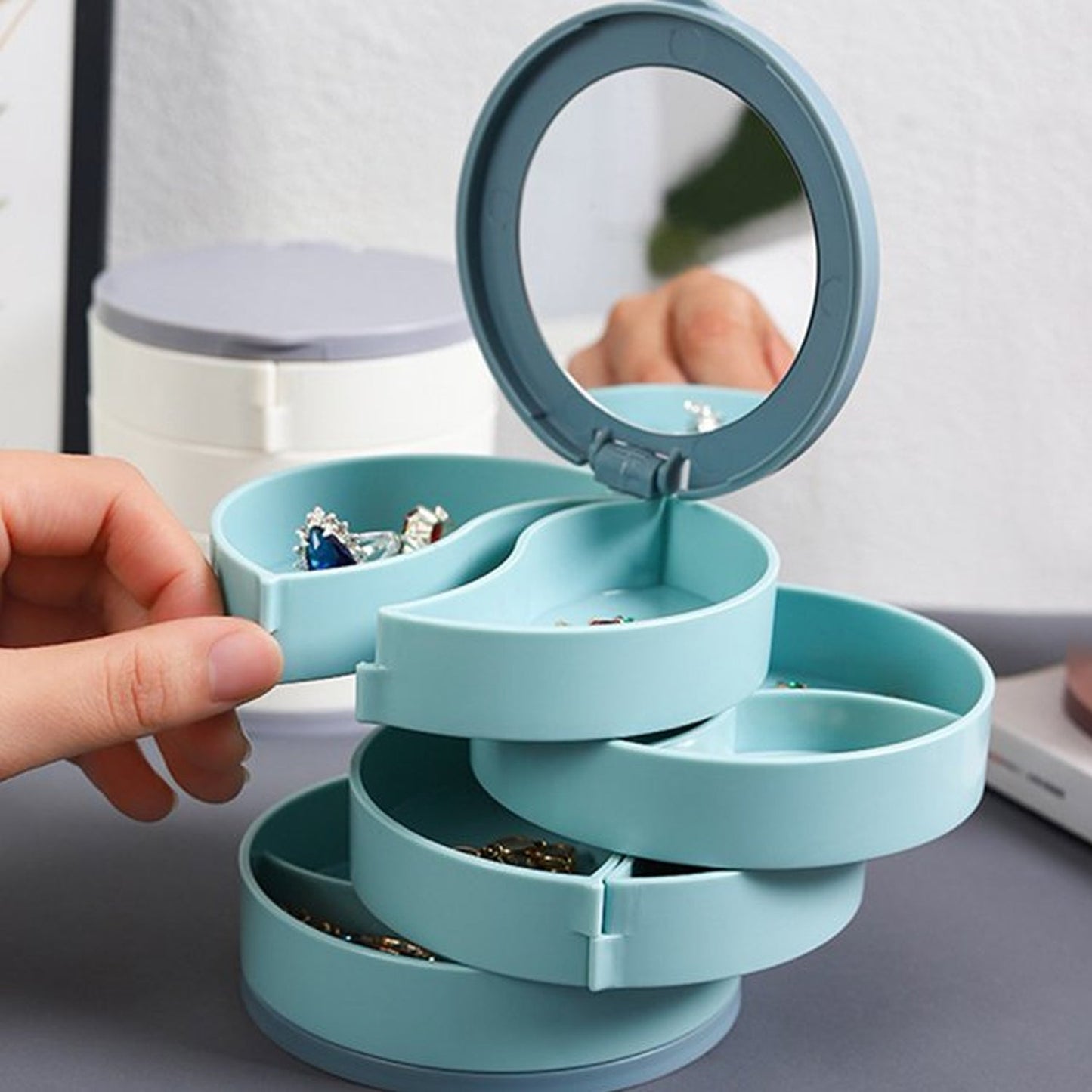 4 layers rotating jewelry box made of eco-friendly ABS plastic with built-in mirror for easy access
