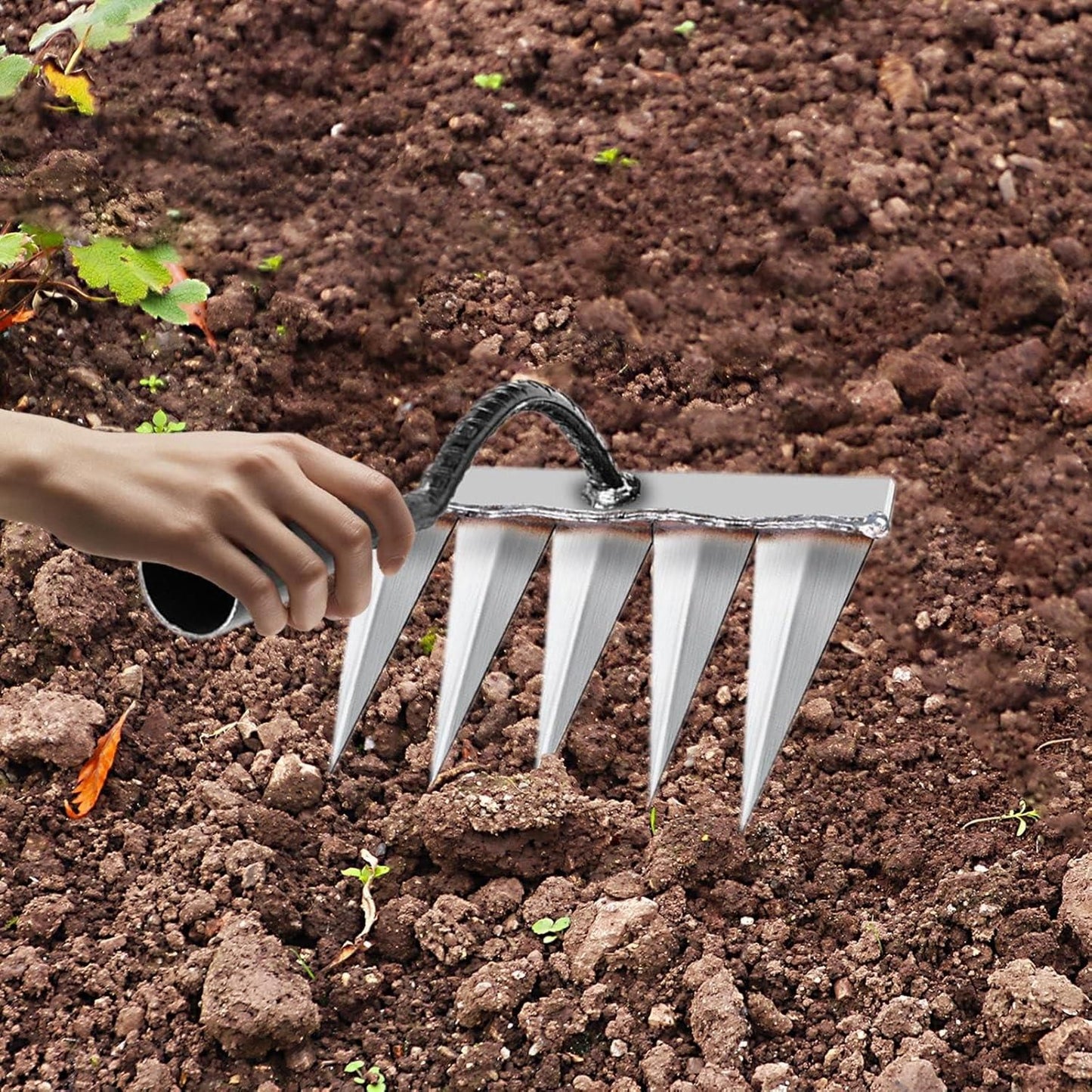 manual hand rake tool for flower beds and vegetable patches, gardening tool for aerating and preparing soil by hand, multipurpose garden rake with steel teeth for weeding and cultivation, heavy duty soil loosening rake for backyard and terrace garden, carbon steel garden rake for weeding and landscaping India