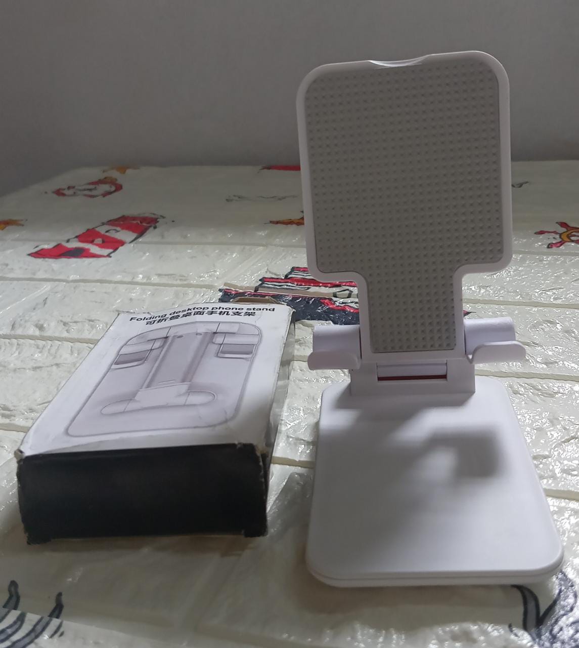 Convenient foldable mobile stand for hands-free viewing. foldable mobile stand, adjustable phone holder, tablet stand for desk, portable phone stand, iPad mini stand, universal mobile holder, desk stand