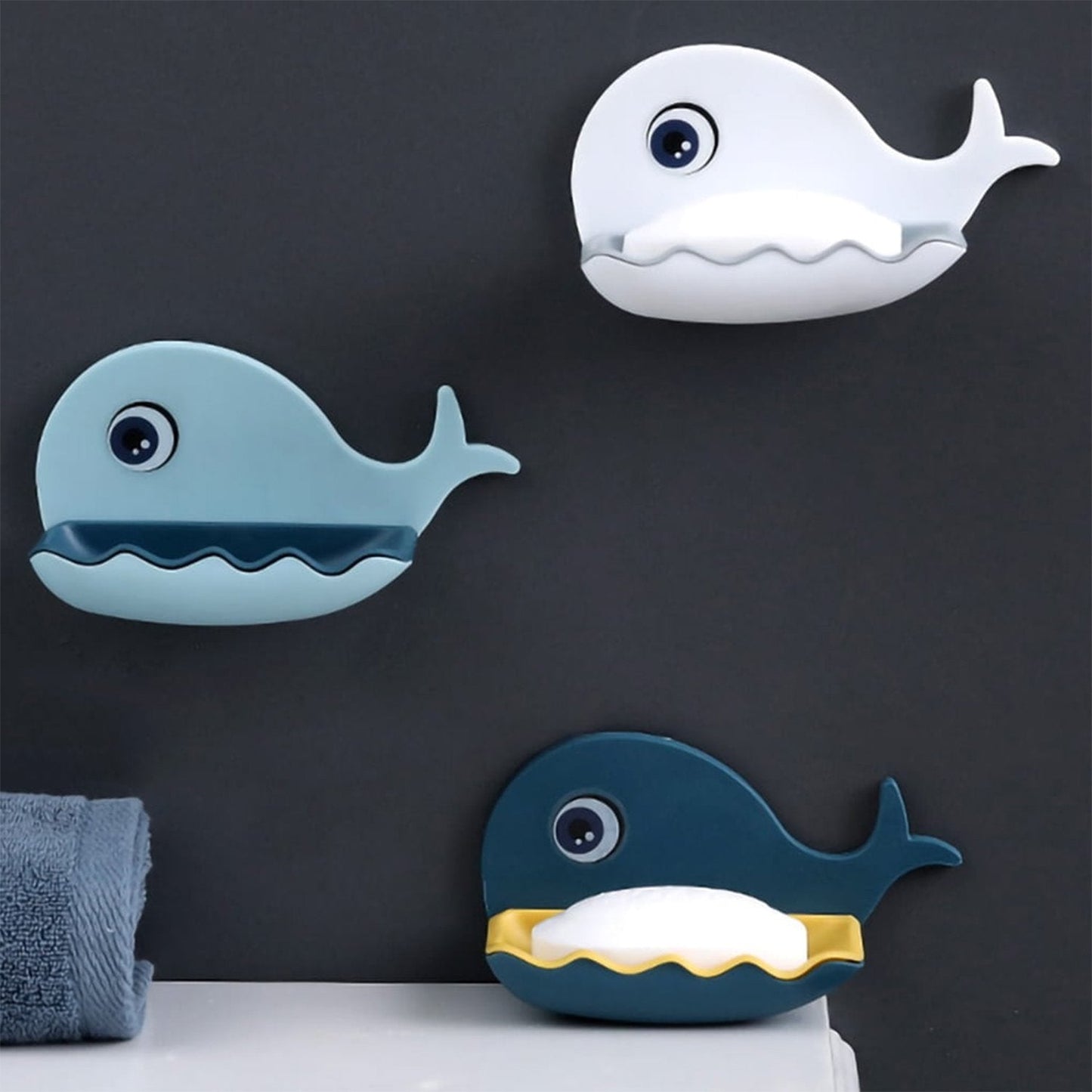 Detailed view of the fish-shaped soap dish holder, highlighting its adhesive feature and drainage design, plastic soap dish, wall mounted soap case, fish design soap stand, bathroom soap holder, kitchen soap tray, self drain soap case, waterproof soap box