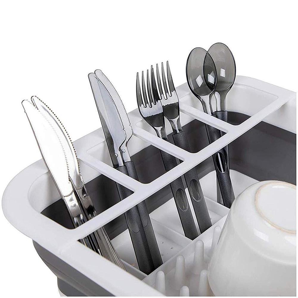 Collapsible silicone rack for drying dishes and storing utensils. collapsible dish drying rack, folding kitchen drainer, silicone dish rack, drying tray with utensil holder, rustproof dish drainer, compact dish drying rack, camping dish drainer, countertop dish tray, dishwasher safe dish rack, kitchen drying stand