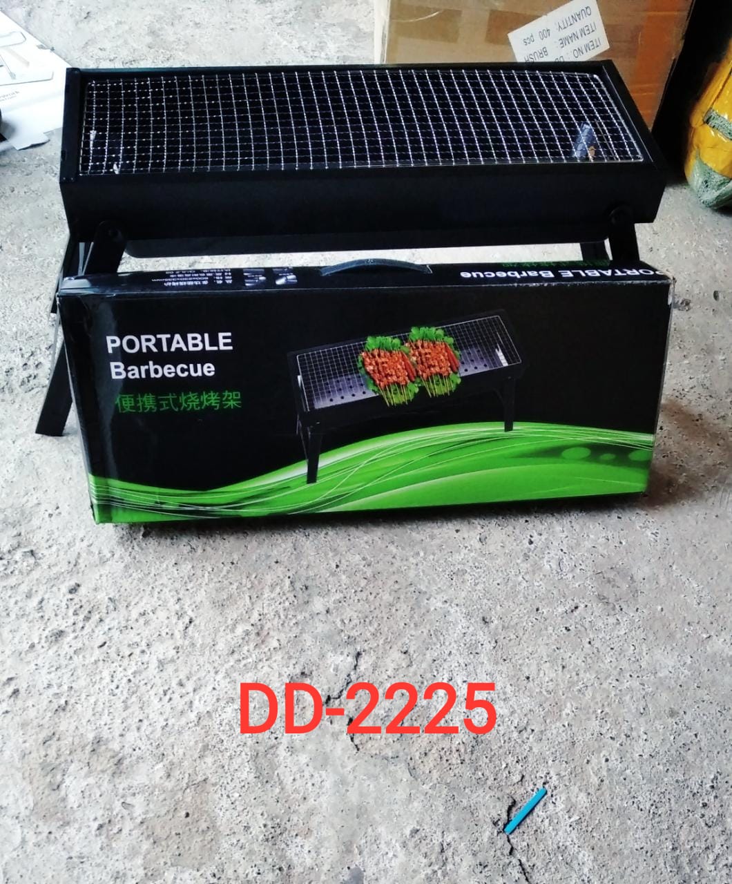 Barbecue grill with foldable design and compact storage. portable charcoal grill, foldable BBQ grill, outdoor barbecue grill, camping grill, travel BBQ grill, garden charcoal stove, picnic BBQ setup