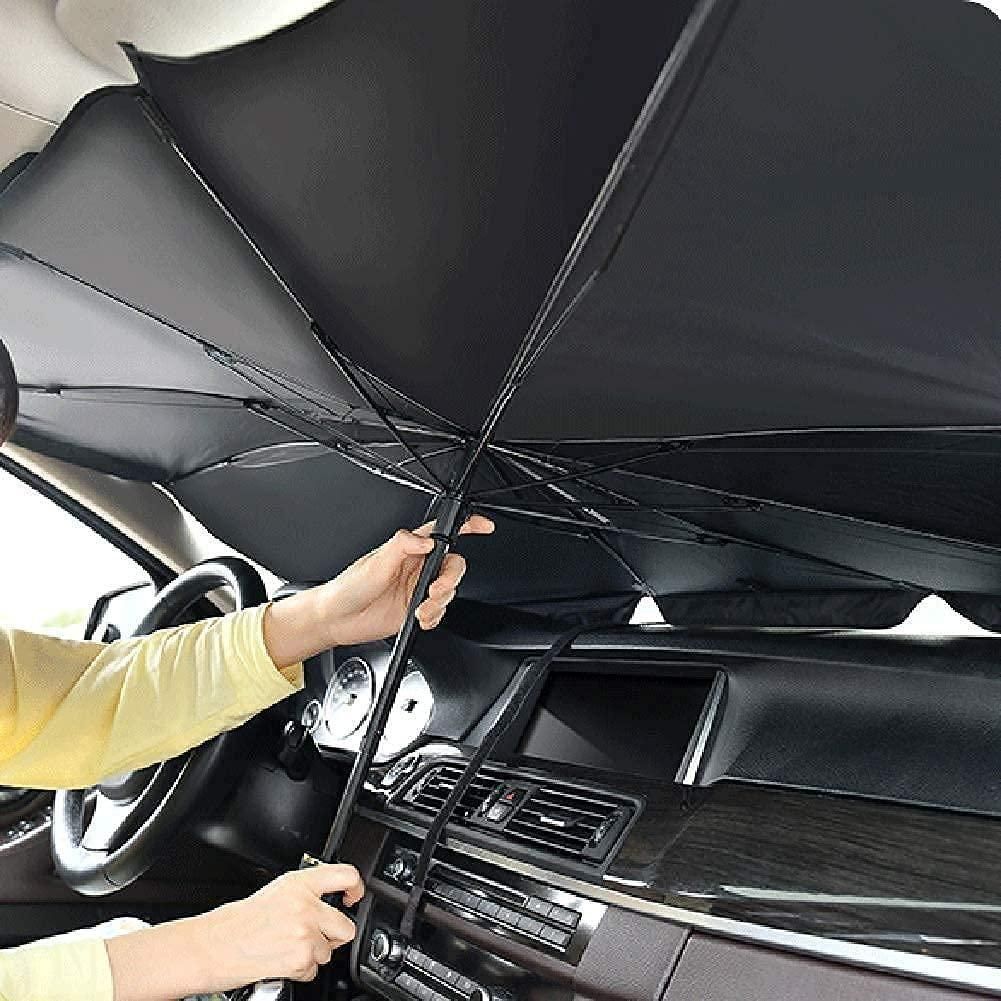 Person holding a black umbrella inside a car. Car thermal insulation umbrella shade blocking heat and UV rays for comfortable driving experience