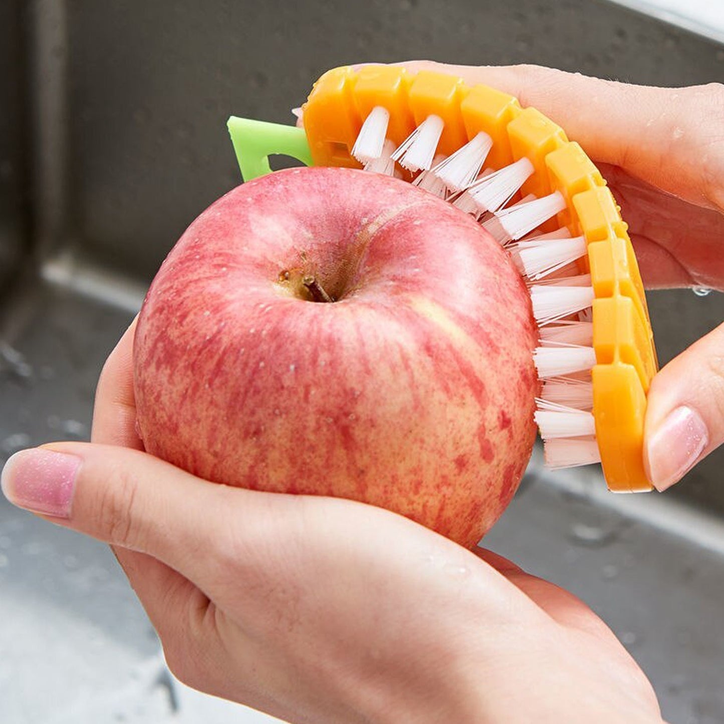 Household scrubbing brush used for apple cleaning