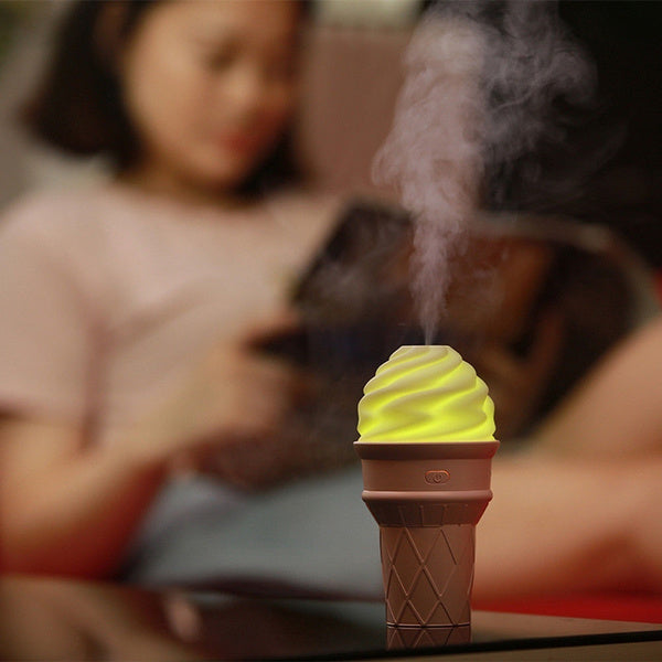 Compact USB humidifier providing mist spray on office desk