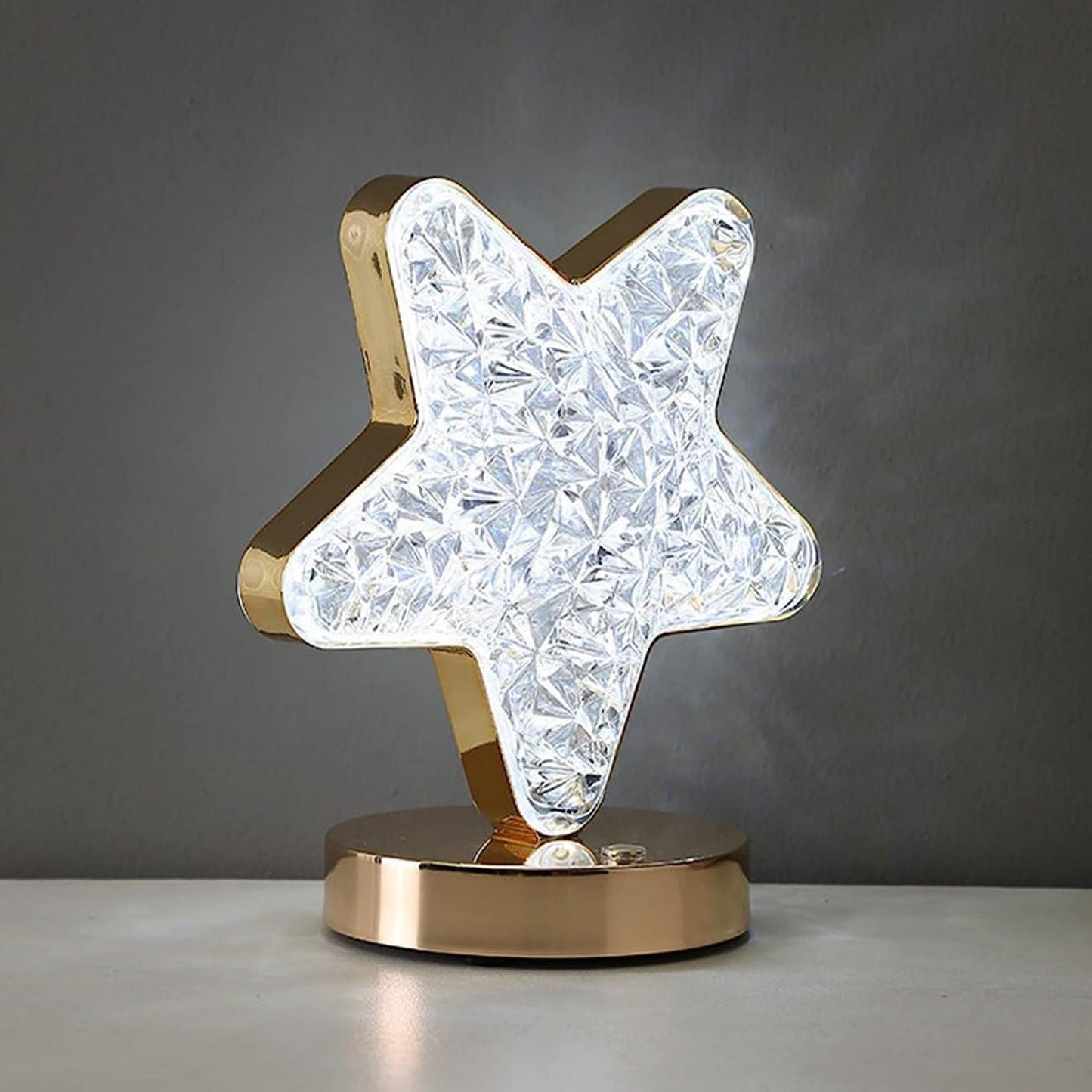 Elegant star shape LED lamp with non-slip base on wooden surface
