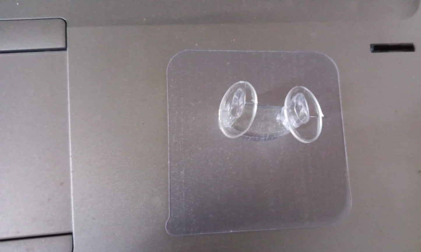 Clear adhesive wall hook used for organizing entryway items