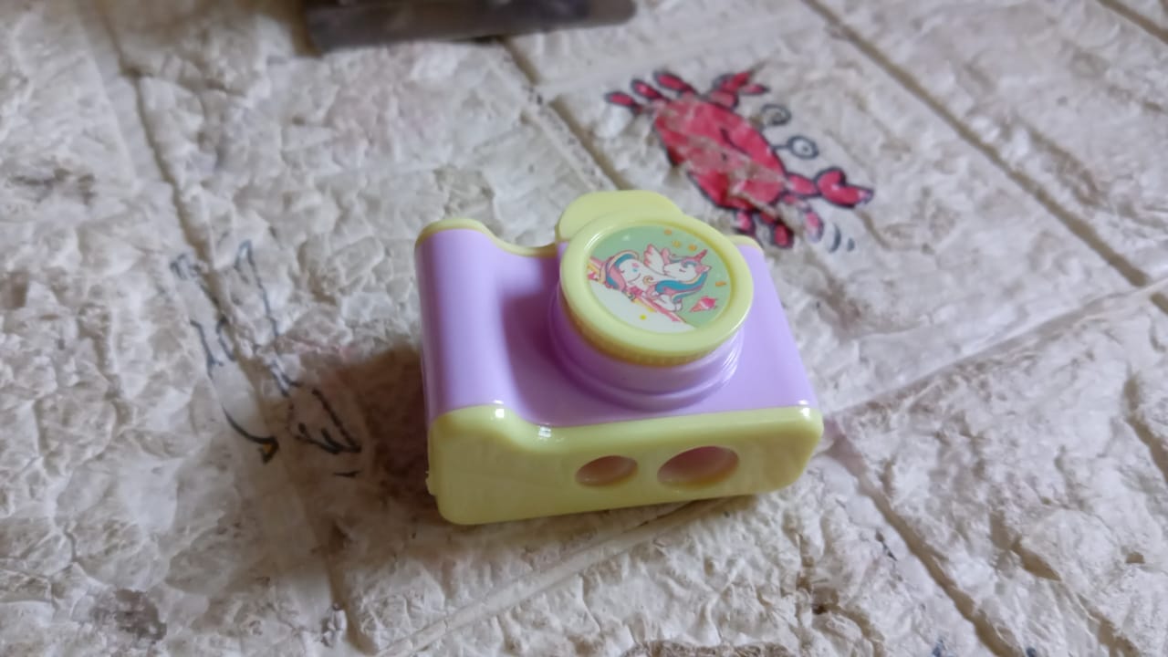 Bright and reusable pencil sharpener with camera design