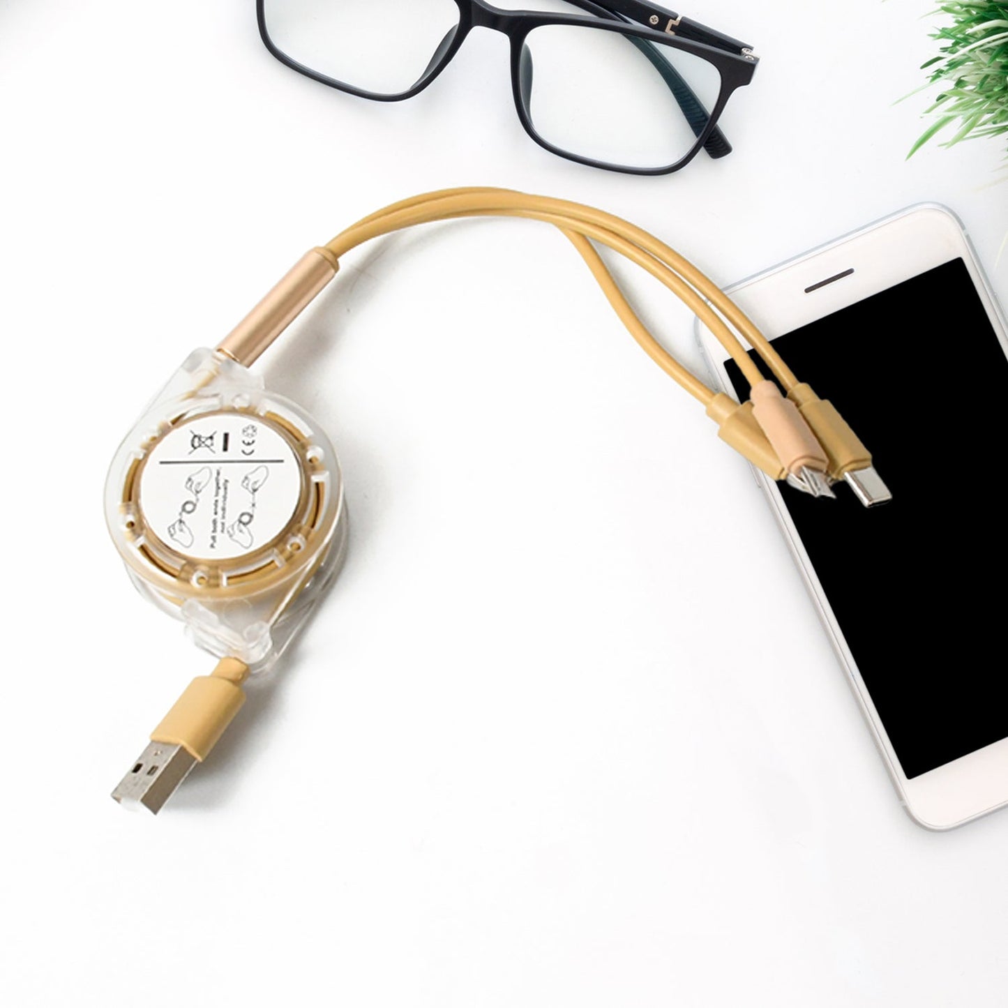 Multi device USB charging cable with compact retractable design