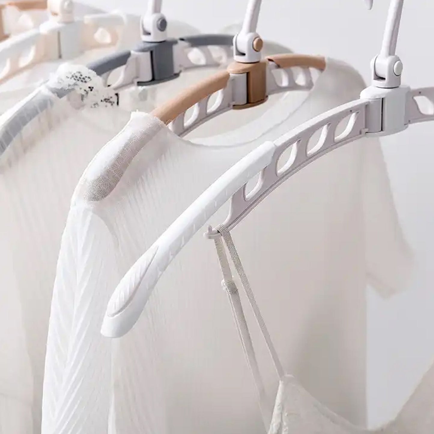 Adjustable folding hanger suitable for sweaters, jackets, and delicate clothes at home