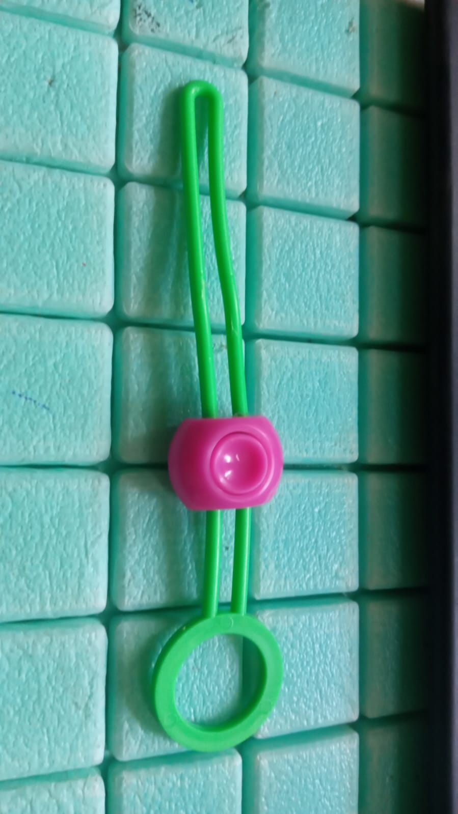 Plastic bag clip used as cable tie for chargers and cords