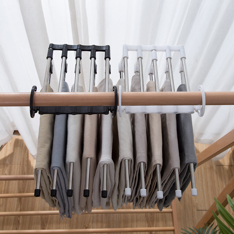 Space-saving trouser hanger with adjustable arms for versatile storage. multi-layer pants hanger, 5 in 1 trouser hanger, folding pants rack, closet space saver, stainless steel pants hanger, travel trouser hanger, wardrobe organizer