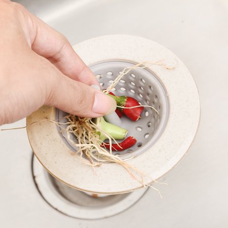 Food scraps caught in silicone kitchen sink strainer