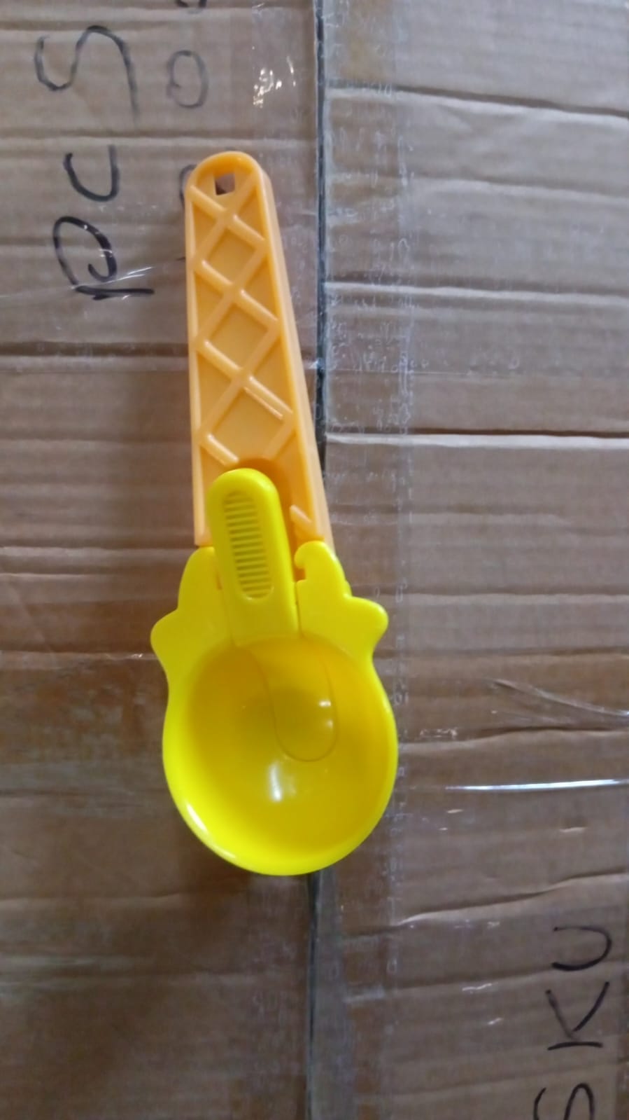 Ice cream scoop set stored hanging on kitchen rack