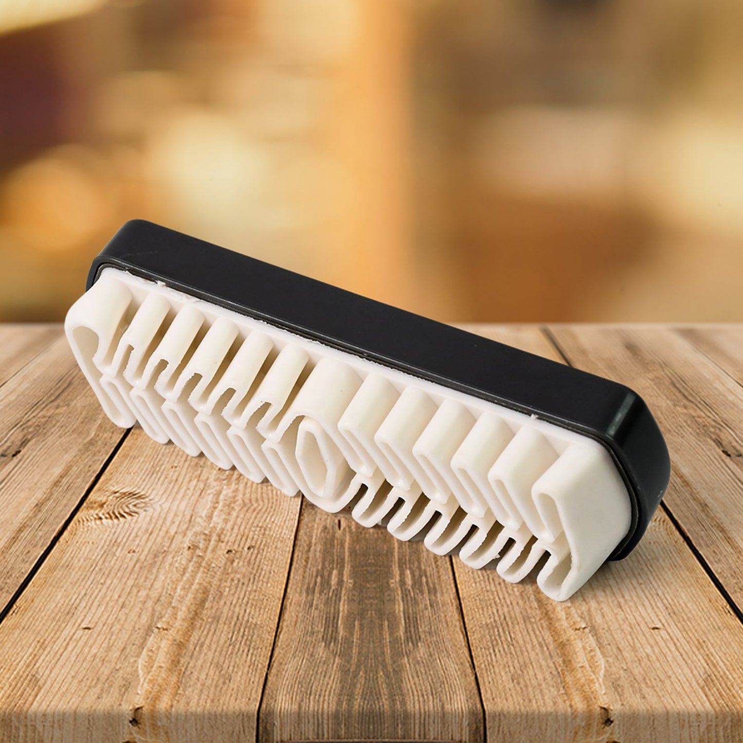 Portable shoe cleaning brush with rubber crepe surface