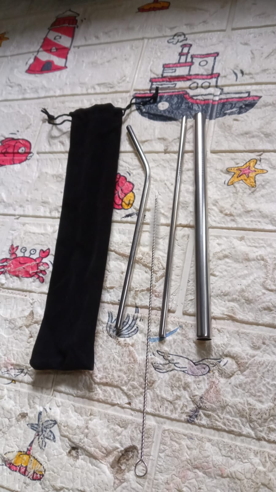 Eco-friendly metal drinking straws packed for travel use