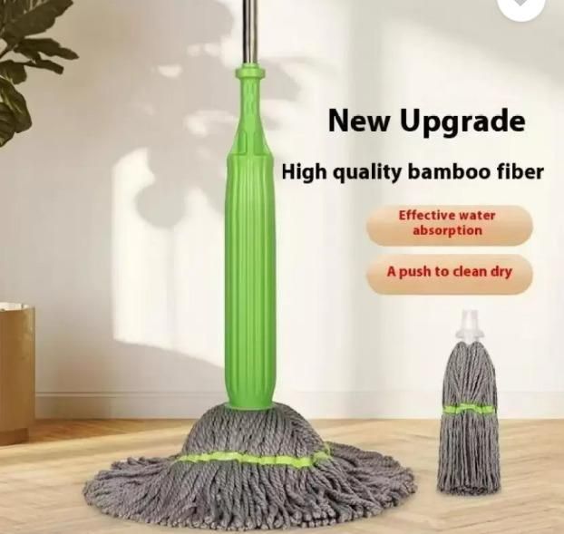 Green mop with gray bamboo fiber head on a wooden floor, with text highlighting features. Microfiber mop head showing 55cm diameter coverage area and effective water absorption capabilities