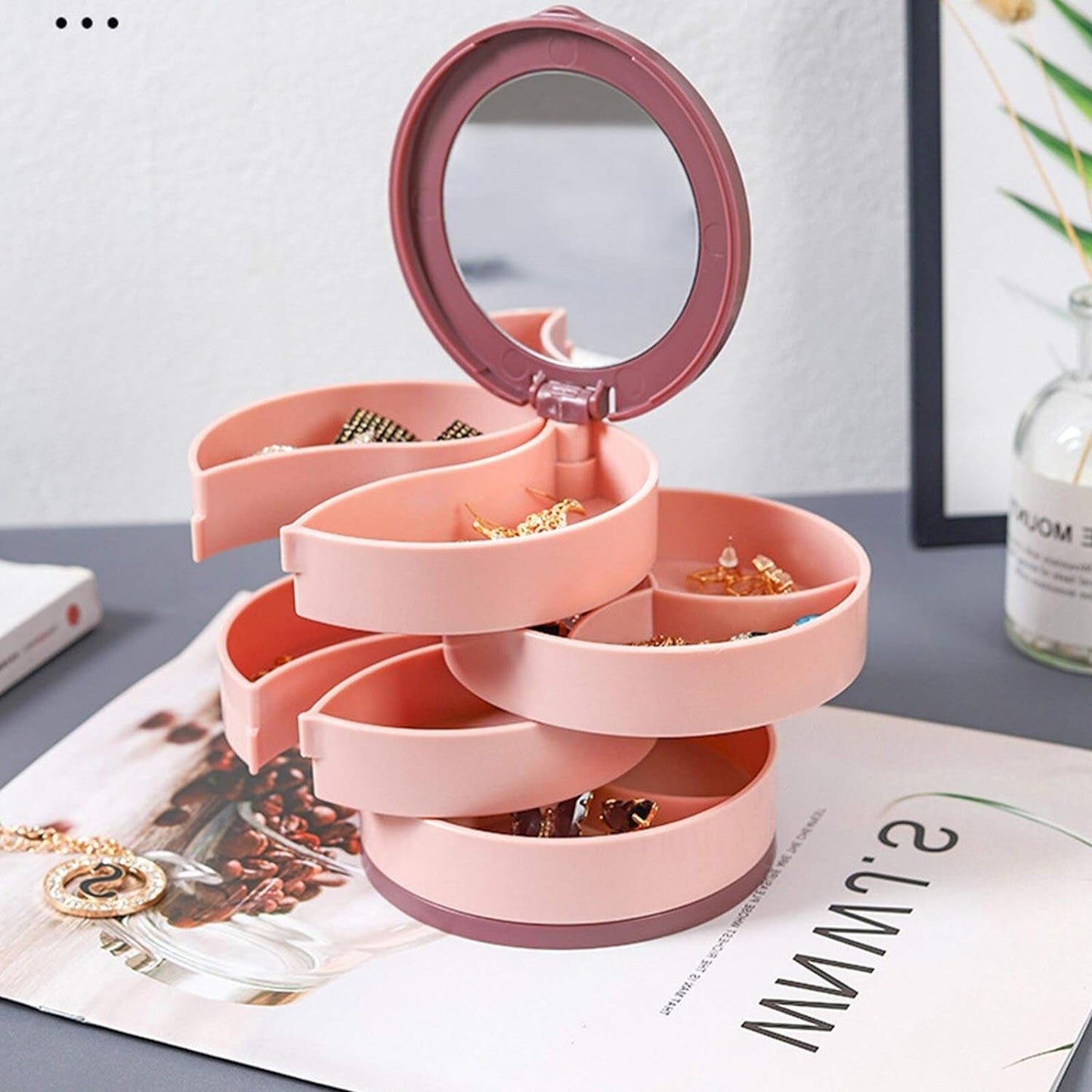 Portable jewelry box with rotating feature, compact for travel and daily home use