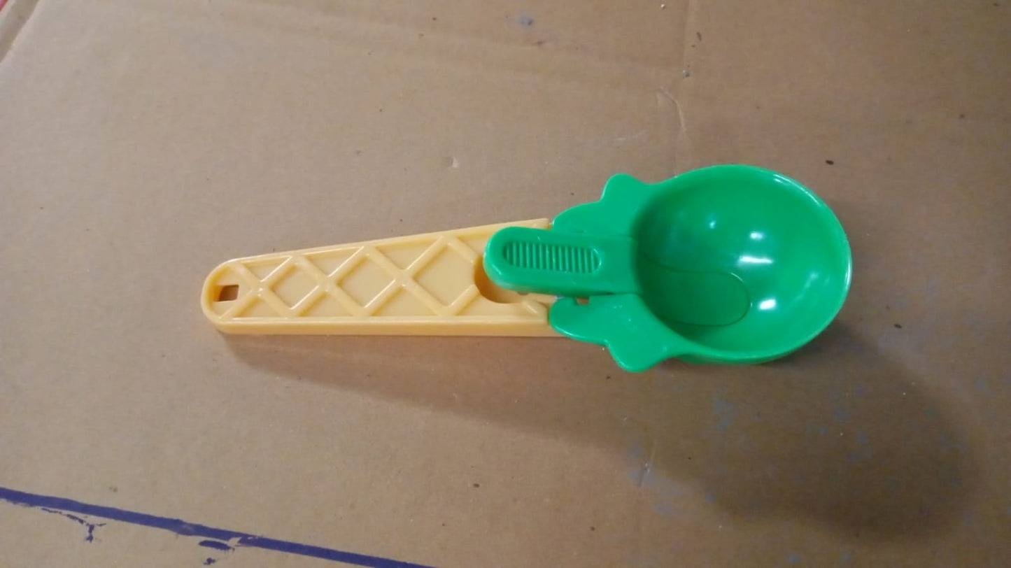 Plastic trigger handle scooping fresh melon balls