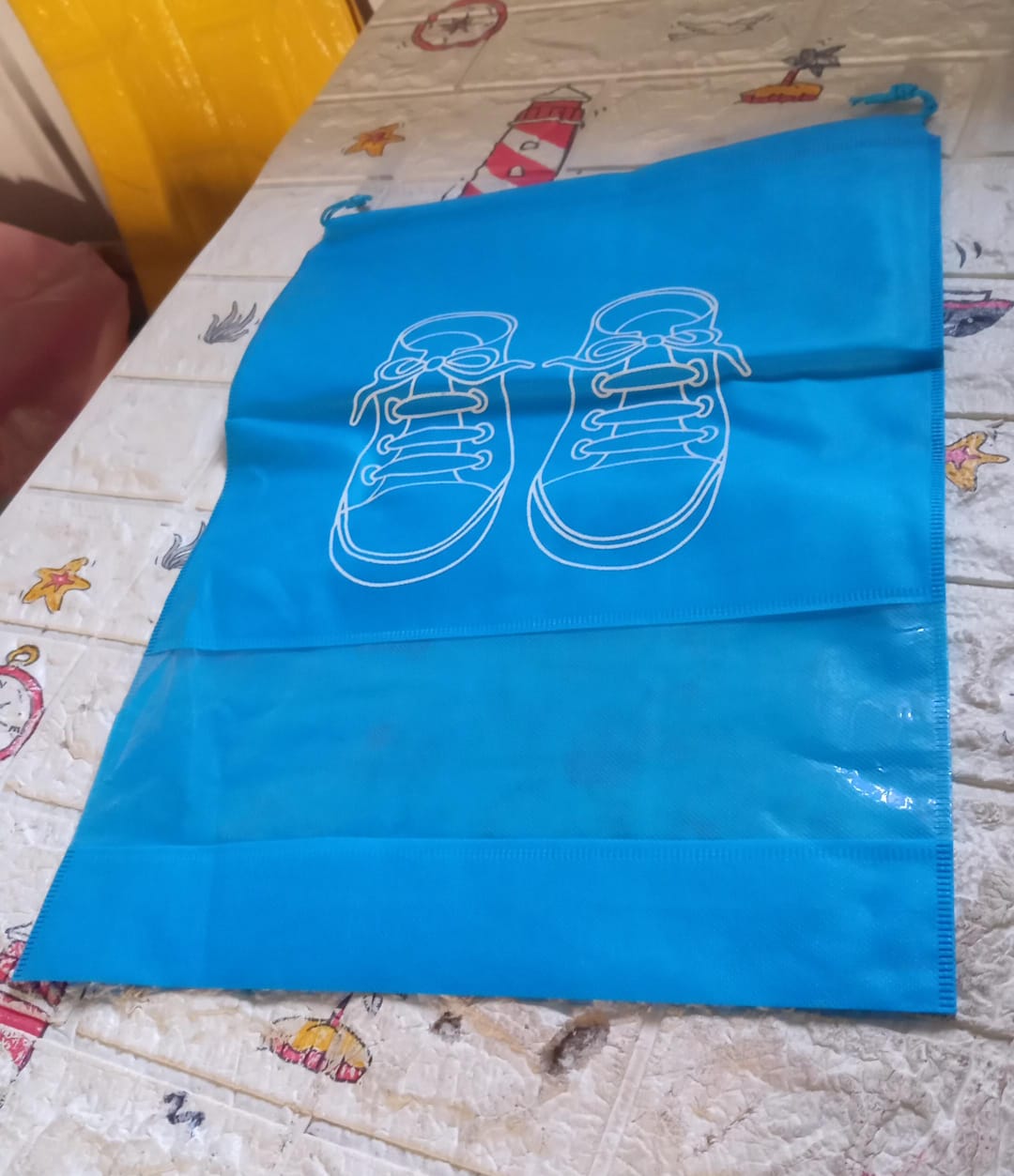 Closet organizer shoe bag in compact design, easy hanging in wardrobe or suitcase for organized packing