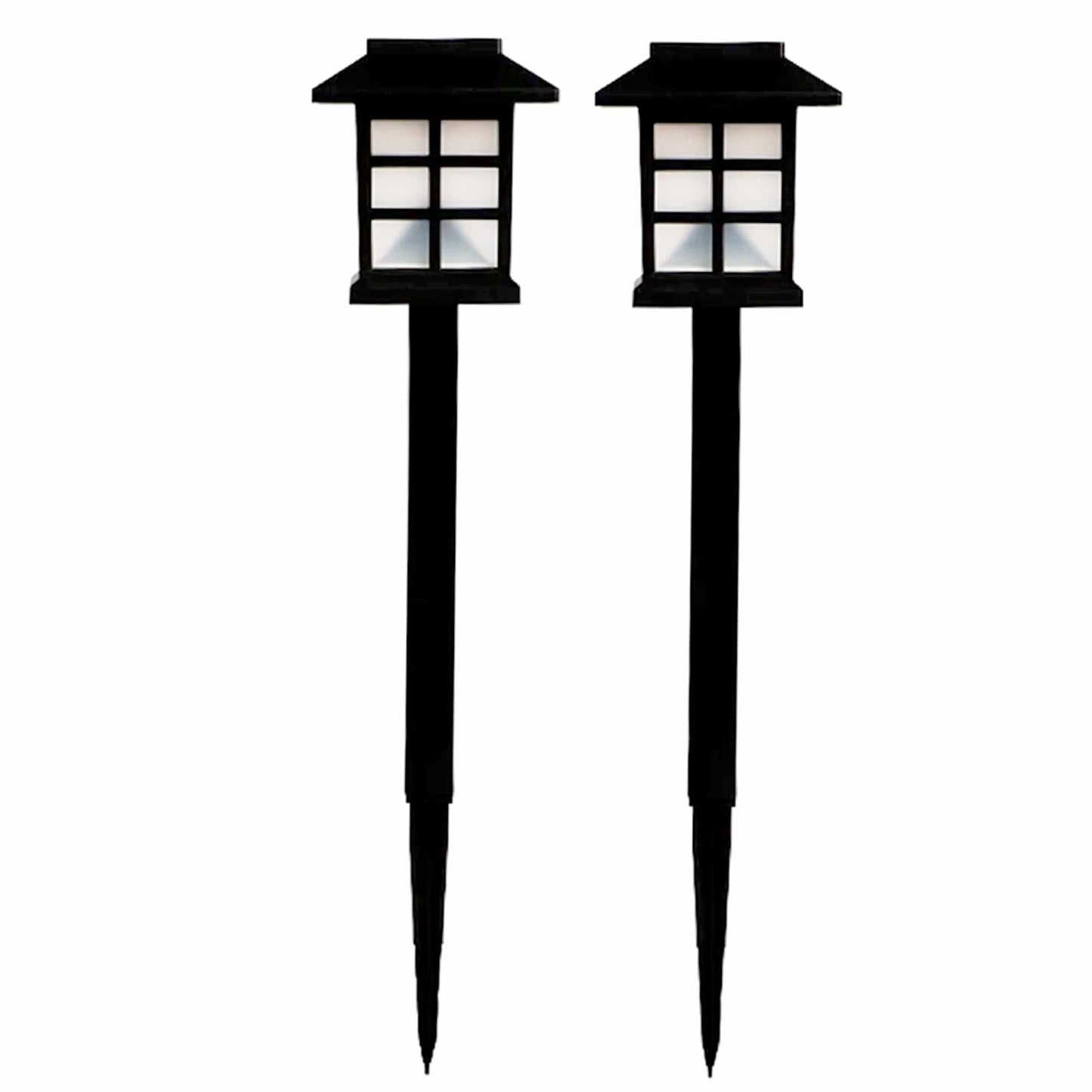 Solar powered pathway lamps illuminating outdoor yard