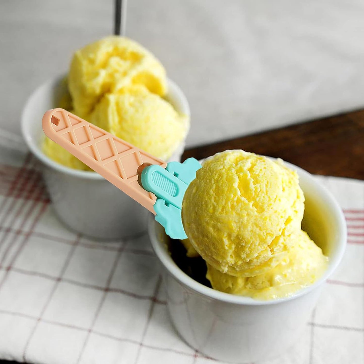 Non-slip plastic ice cream spoon with ergonomic trigger release