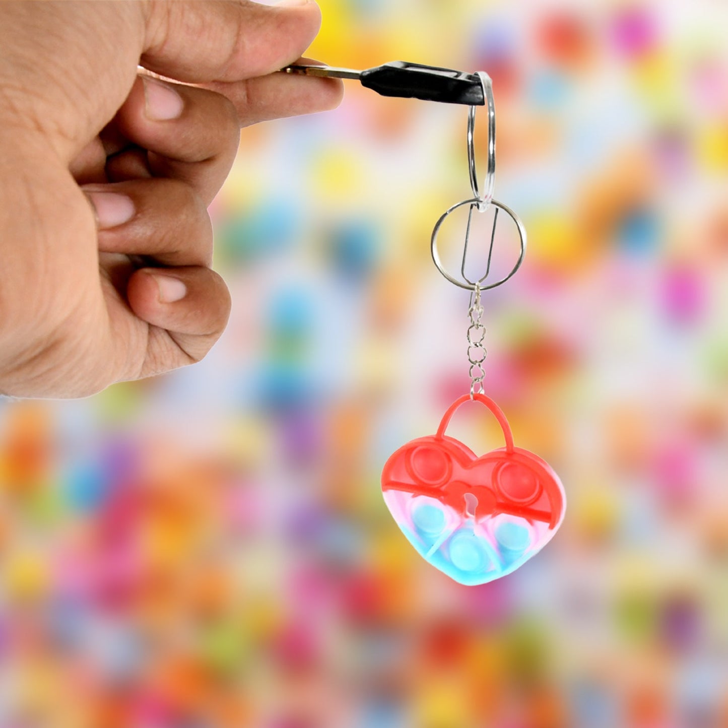 Travel-size silicone fidget keychain with colorful bubbles