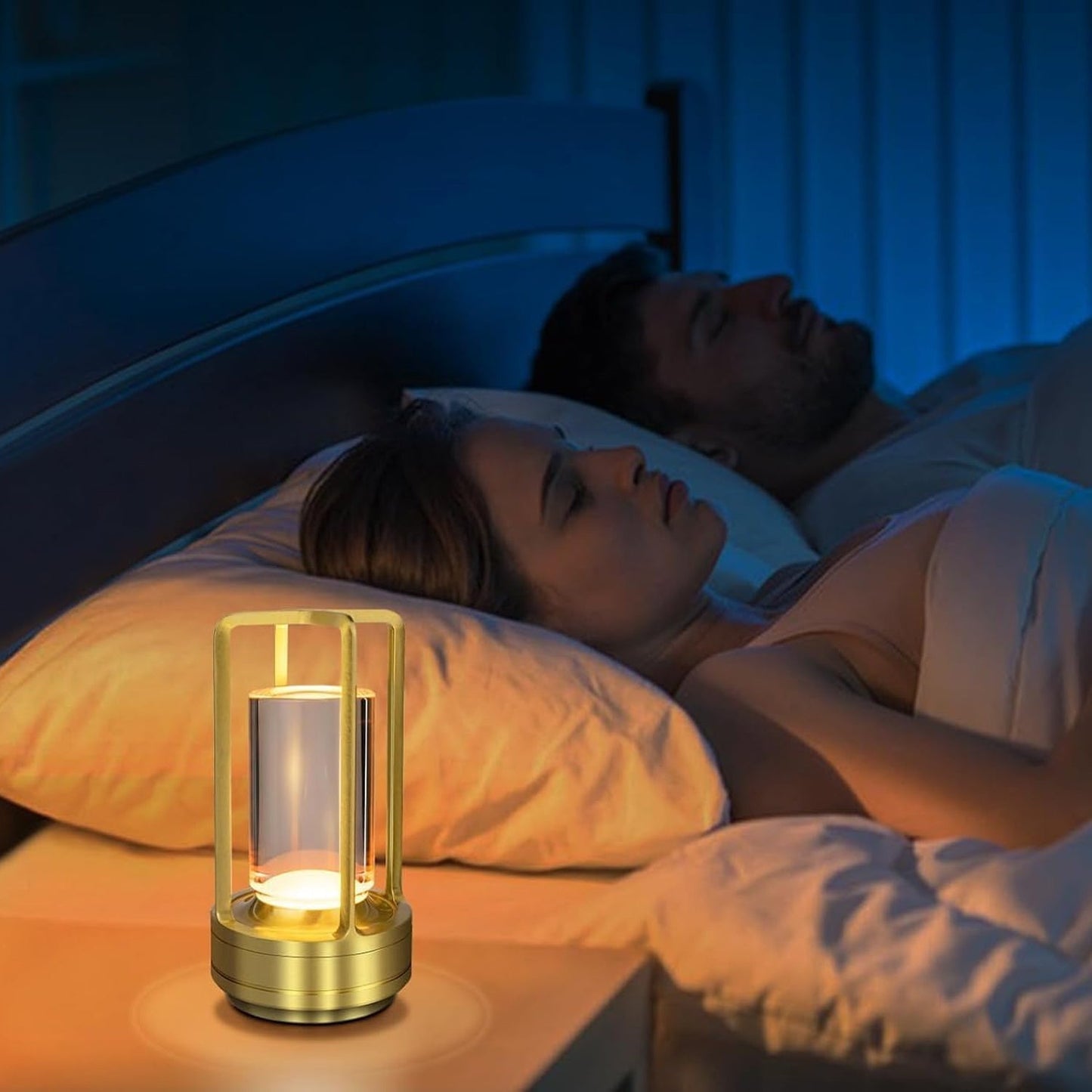 Crystal table lamp alongside a bed shown