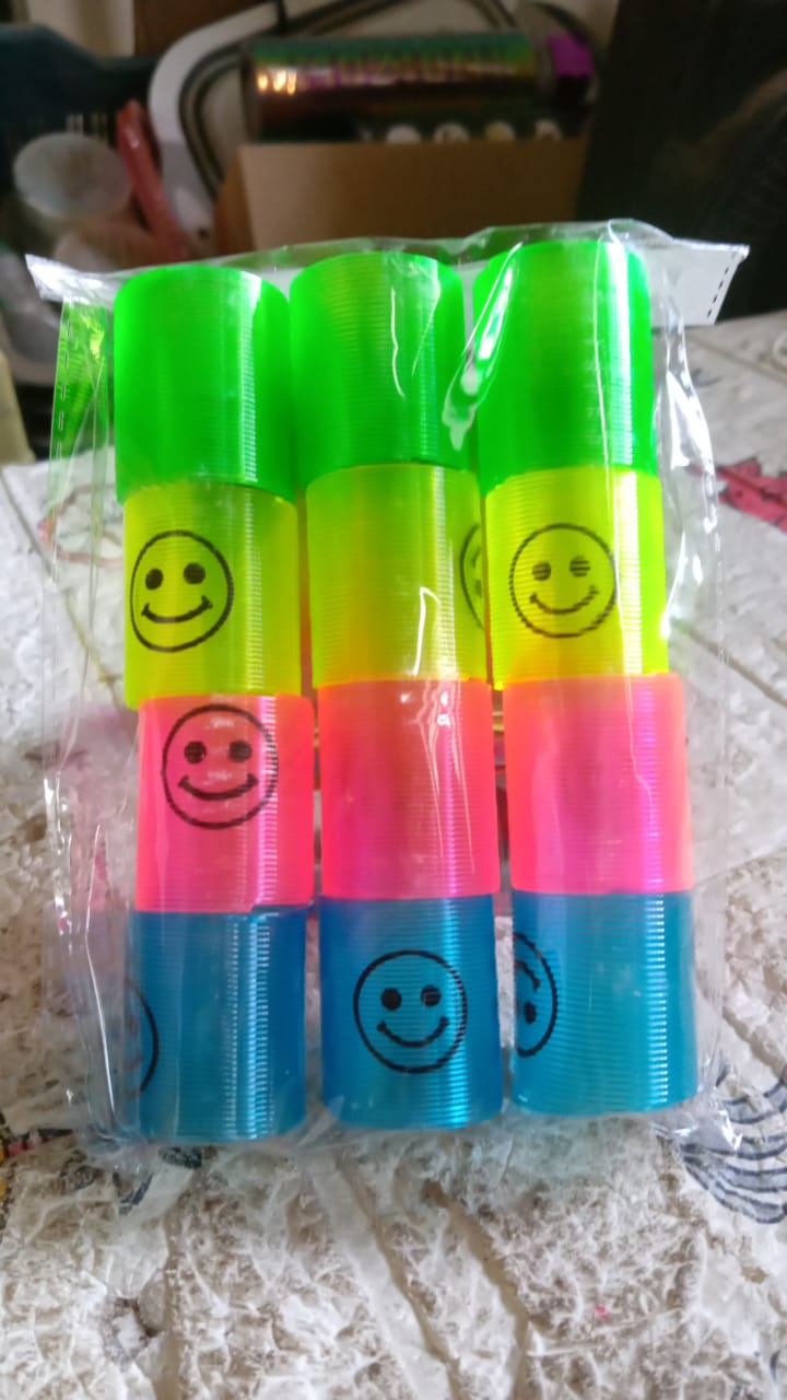 Multicolor smiley spring toys in compact, easy-to-carry box