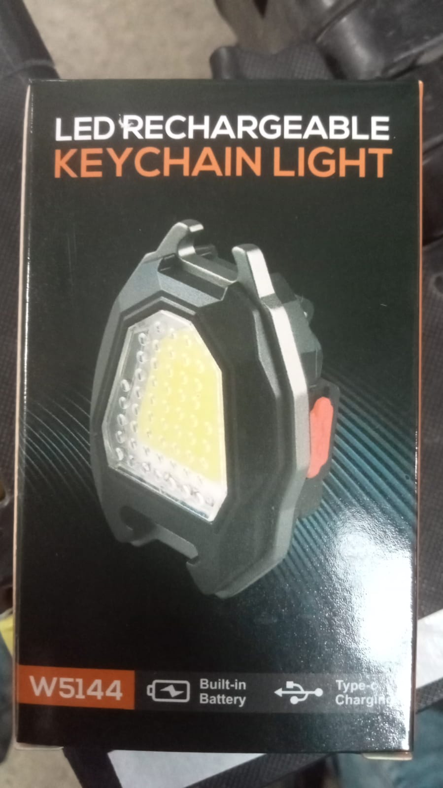 Portable flashlight with cigarette lighter and magnetic keychain