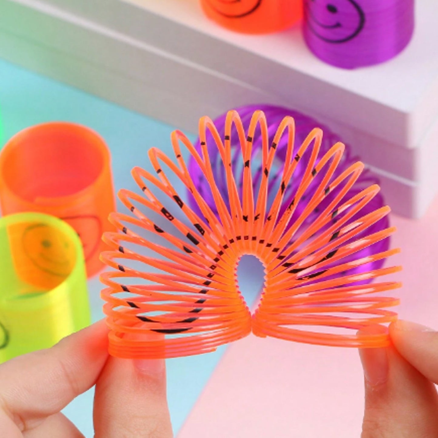 Set of 12 multicolor rainbow spring toys for kids party gift