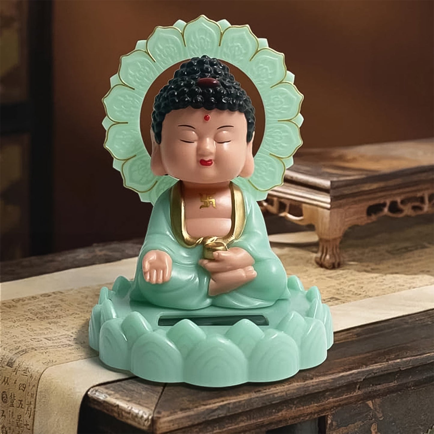 Solar powered nodding Buddha statue plastic with glowing base