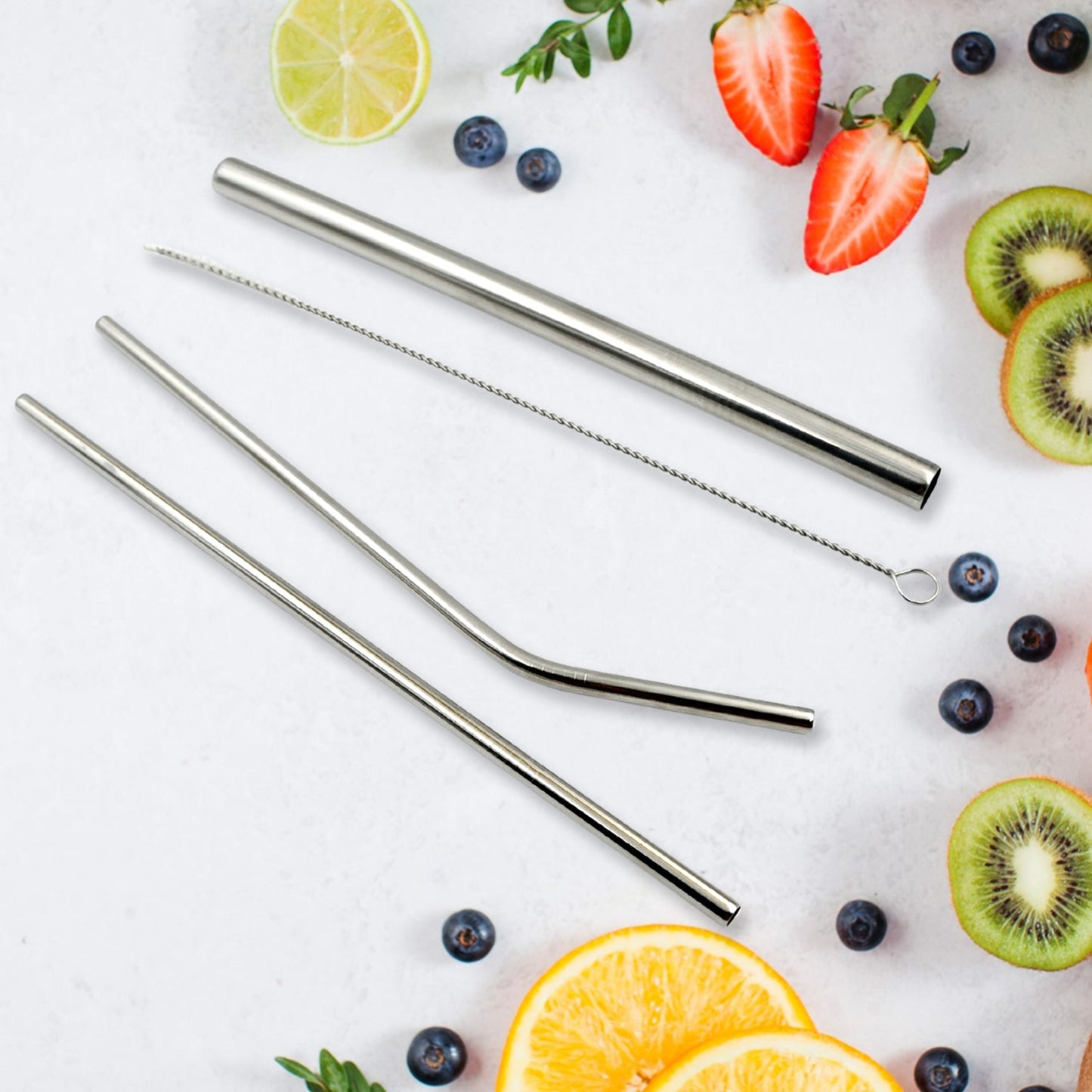 Set of four stainless steel straws shown with cleaning brush