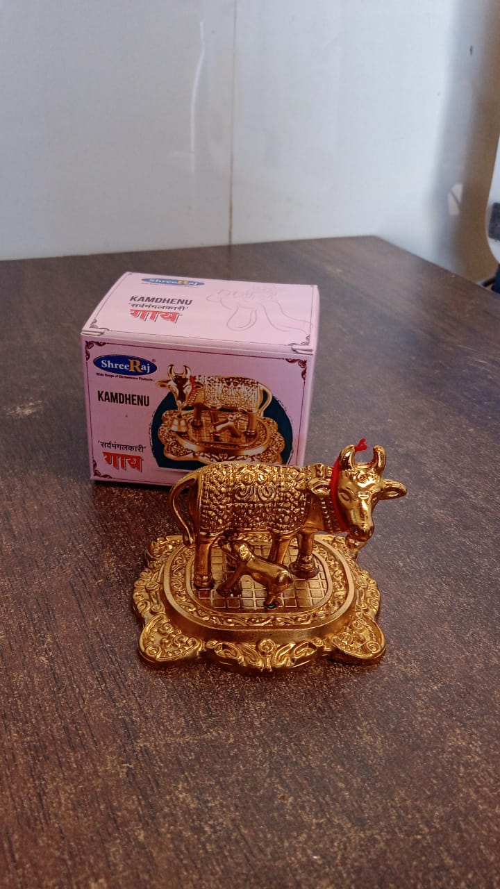 Kamdhenu cow figurine, Kamdhenu murti for pooja, decorative brass cow and calf, Hindu spiritual cow idol, vastu shastra cow statue, handcrafted pooja decor item, golden cow idol with calf, Indian religious figurine, Kamadhenu cow idol India, divine cow sculpture for temple
