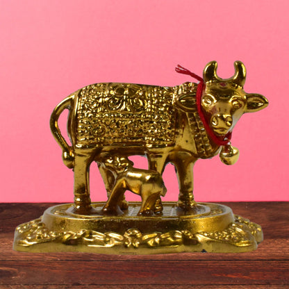 Kamdhenu cow idol, Kamadhenu cow with calf, metal cow idol India, Kamdhenu statue for home, golden cow idol for pooja, decorative cow and calf statue, Kamdhenu idol brass finish, vastu cow idol, metal Kamadhenu murti, pooja room cow statue

