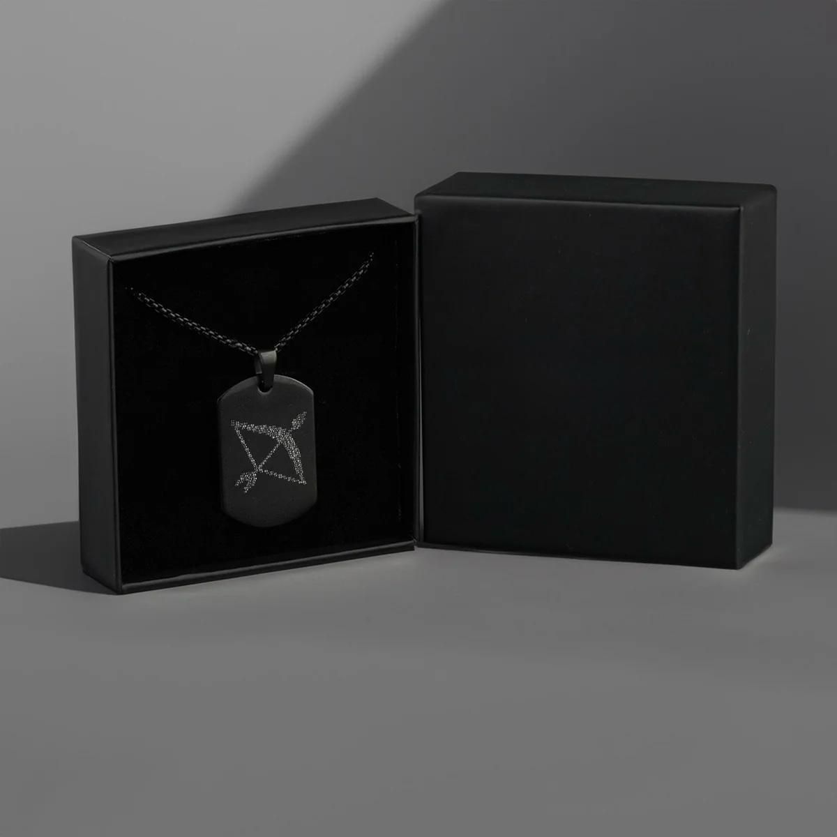Stylish Ram Naam pendant with black chain, Men's Ram Baan necklace close-up, Black chain Ram Naam pendant for men, Microcarved Ram Baan pendant necklace, Elegant Ram Naam tag necklace for men, Traditional Ram Baan necklace with black chain, Durable Ram Baan pendant for men, Fashionable Ram Naam microcarved necklace, Men’s religious Ram Baan tag necklace
