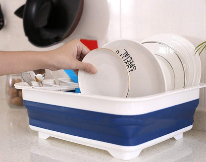 Silicone dish drying rack with utensil storage, collapsible design. collapsible dish drying rack, folding kitchen drainer, silicone dish rack, drying tray with utensil holder, rustproof dish drainer, compact dish drying rack, camping dish drainer, countertop dish tray, dishwasher safe dish rack, kitchen drying stand