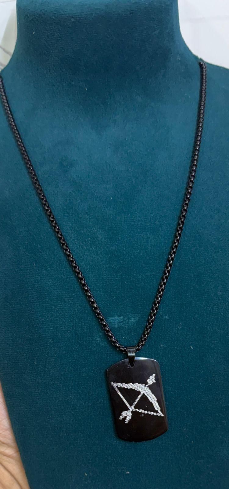 Ram Baan microcarved pendant, black chain men's necklace, Ram Baan necklace online India, best Ram Naam pendant men, designer Ram Baan necklace India, men's devotional pendant necklace, Ram Baan jewelry shop India, men's Hindu pendant necklace, Ram Naam pendant black chain, microcarved religious pendant men