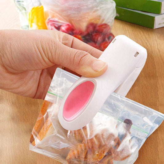 handheld mini sealing machine for food bags, portable bag sealer for snacks and travel use, plastic packet sealing machine compact and battery operated,