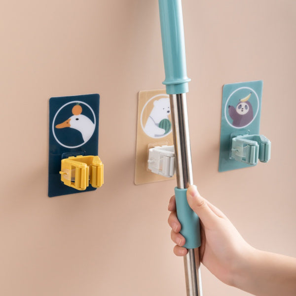 Self-adhesive wall mount for holding mops and brooms securely. wall mounted mop holder, broom organizer, self adhesive holder, kitchen mop rack, reusable wall hanger, anti-slip mop hook, storage rack for tools, mop clip holder