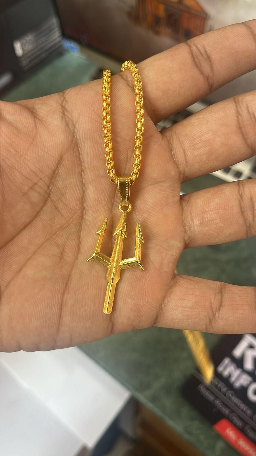 gold plated trishul pendant chain for men, mahadev shiv alloy necklace with trishul pendant, gold finish trishul pendant necklace for men, spiritual mahadev necklace gold plated, trishul pendant chain with alloy necklace, buy gold plated shiv pendant chain online india, mahadev alloy necklace with trishul pendant for men, gold plated alloy pendant necklace for men, trishul necklace with chain gold finish, mahadev spiritual jewelry gold plated necklace

