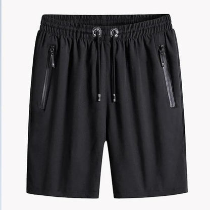 Black shorts with zippers on a white background